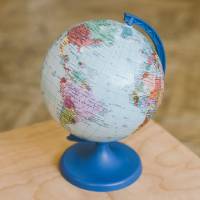 Globe on top of wooden surface